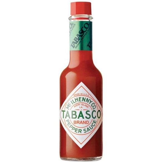 Frasco de vidro do molho de pimenta Tabasco, com tampa vermelha e rótulo branco e verde.
