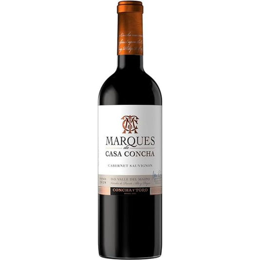 Garrafa de vinho tinto Marques de Casa Concha Cabernet Sauvignon, com rótulo branco e cápsula cobre.